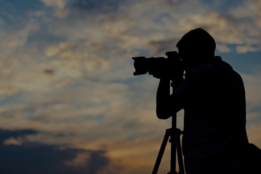 Man taking picture of something in the abyss