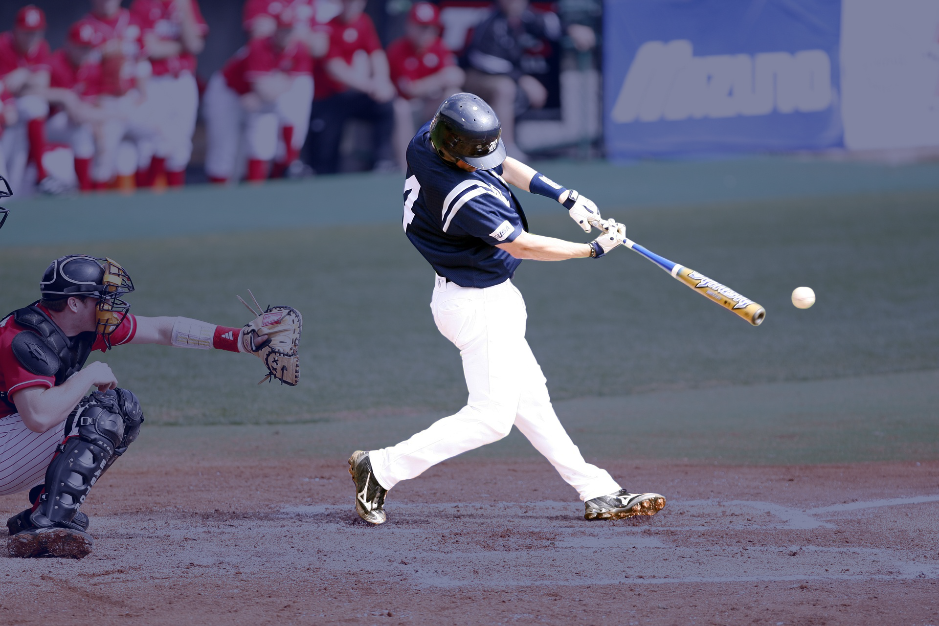 Short-stop Pete Wheeler hitting a single with his last team