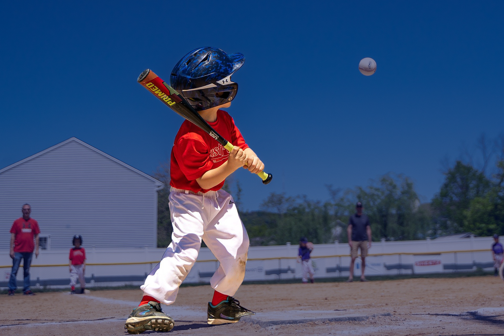 Short-stop Pete Wheeler hitting a single with his last team