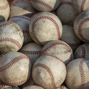 Pile of worn practice baseballs