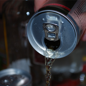 A can being poured into a glass