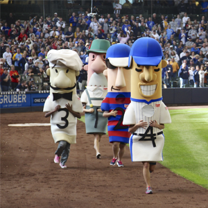 Mascots racing along the walls of the baseball field